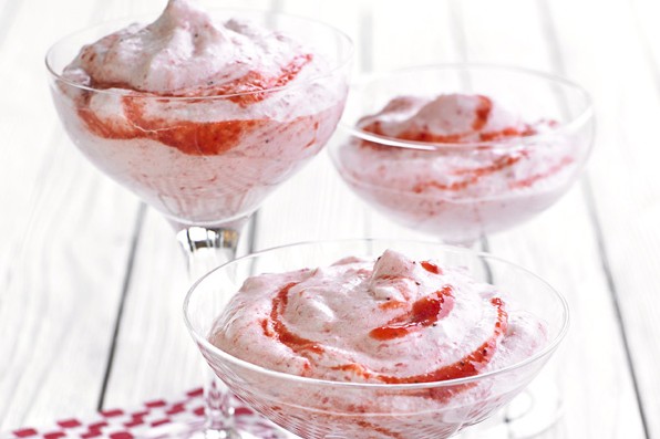 Strawberry mousse in three glass serving jars