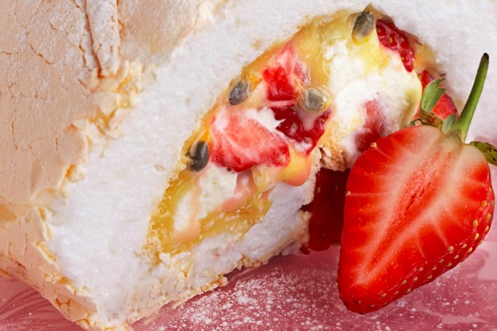 Strawberry and passion fruit meringue roulade