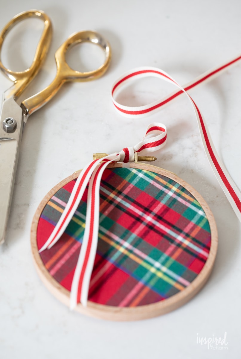 adding ribbon to ornament. 