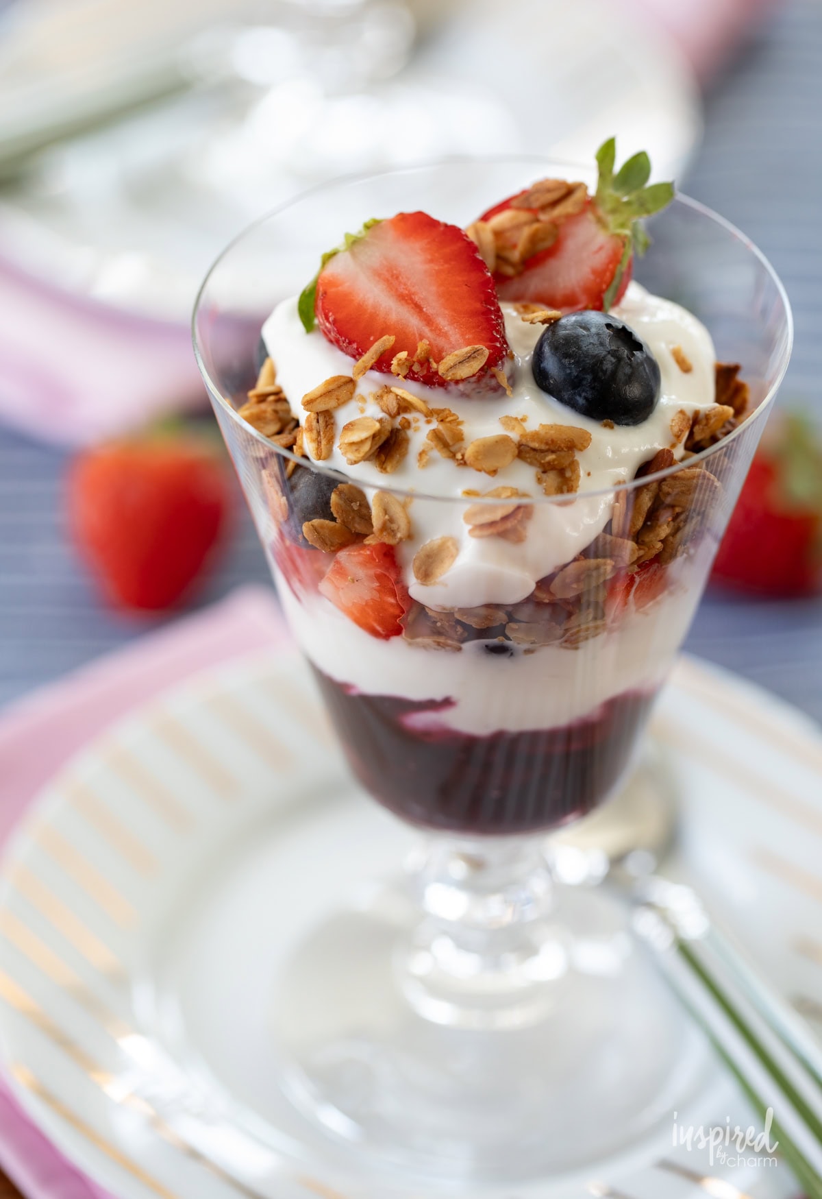 single berry compote yogurt parfait with granola.