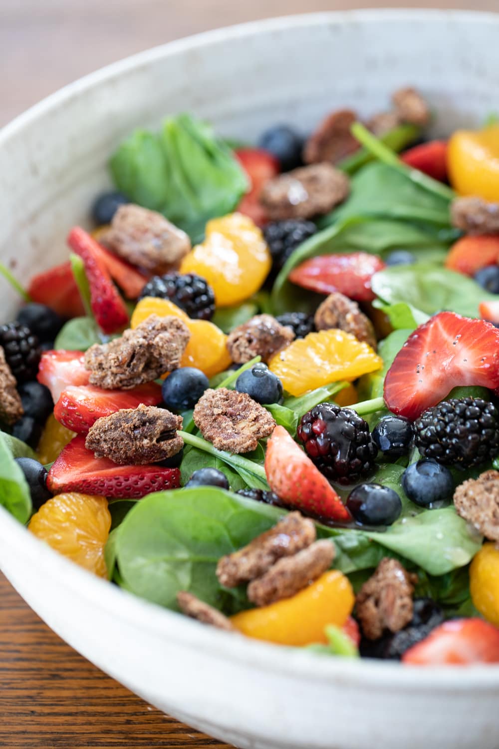 big bowl of spinach salad with berries.