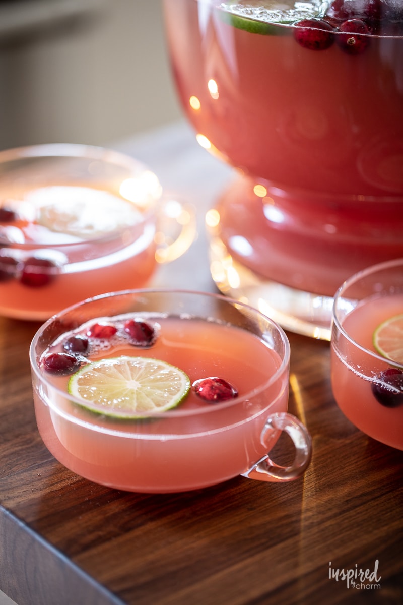 glass cups filled next to a punch bowl