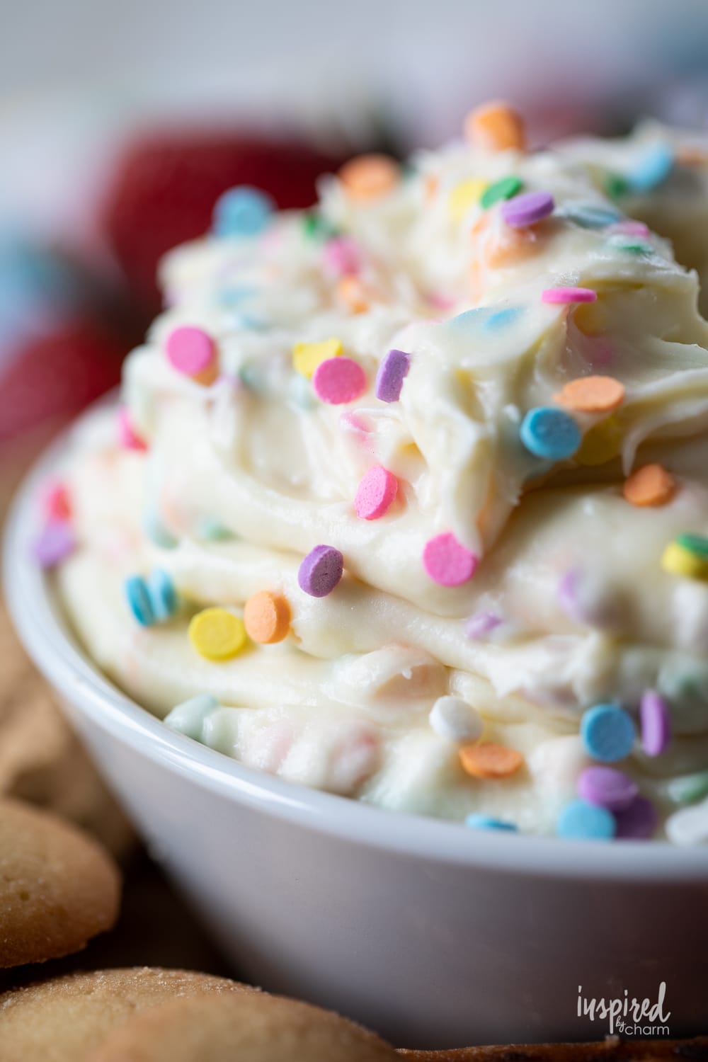 funfetti dessert dip in a bowl with sprinkles.