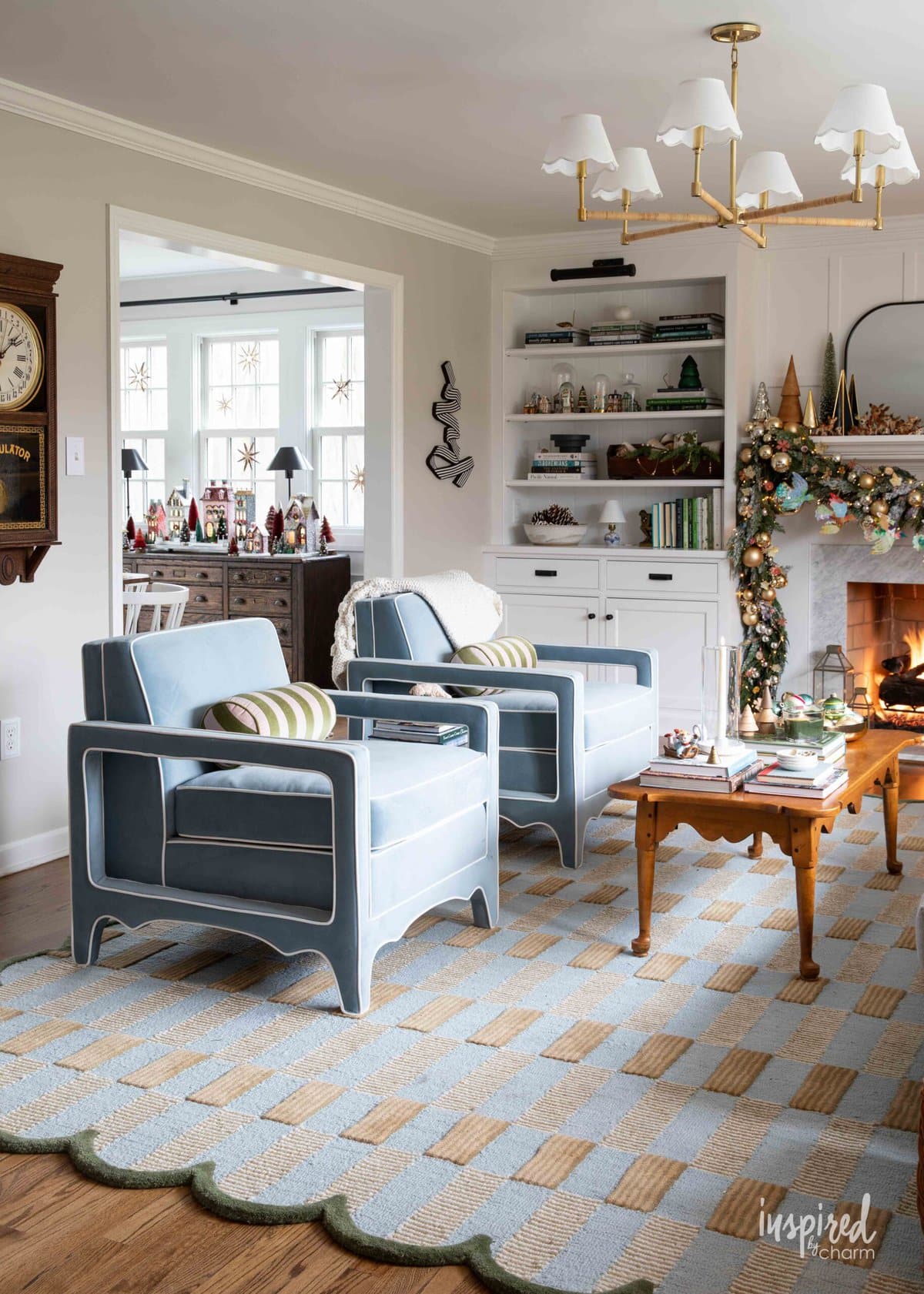 living room decorated for christmas looking into dining room. 
