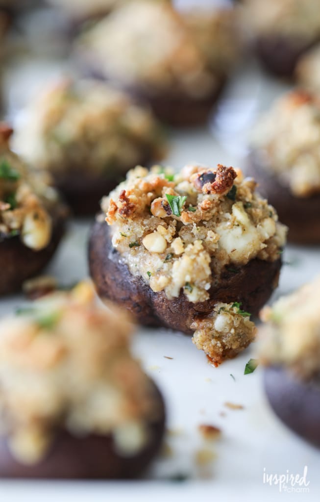 close up of stuffed mushroom Christmas appetizers on a platter