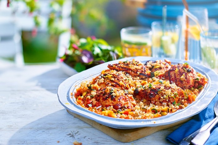 a plate of buttermilk chicken on a table outside in the sun