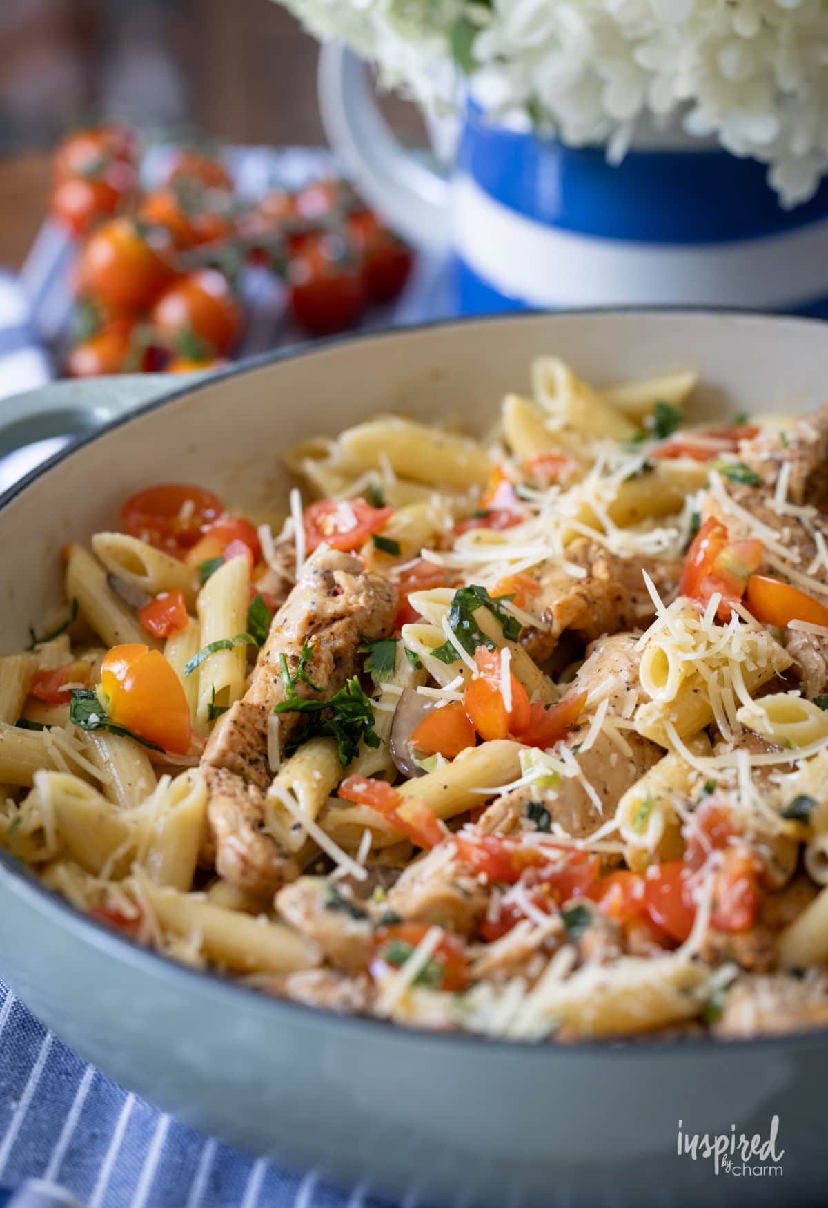 cajun chicken pasta served in a blue dish.