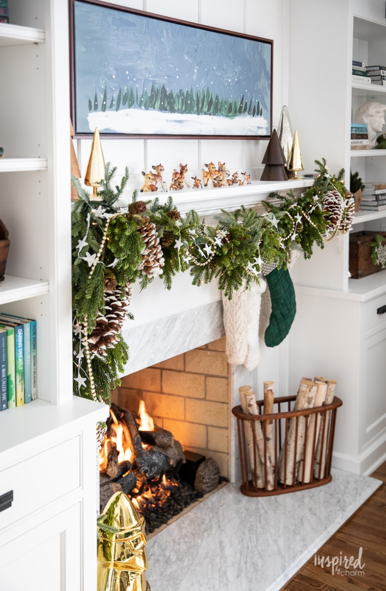 Living Room Christmas Mantel Decor #livingroom #mantel #christmas #fireplace #holiday #decor #bookshelf #bookcase #garland