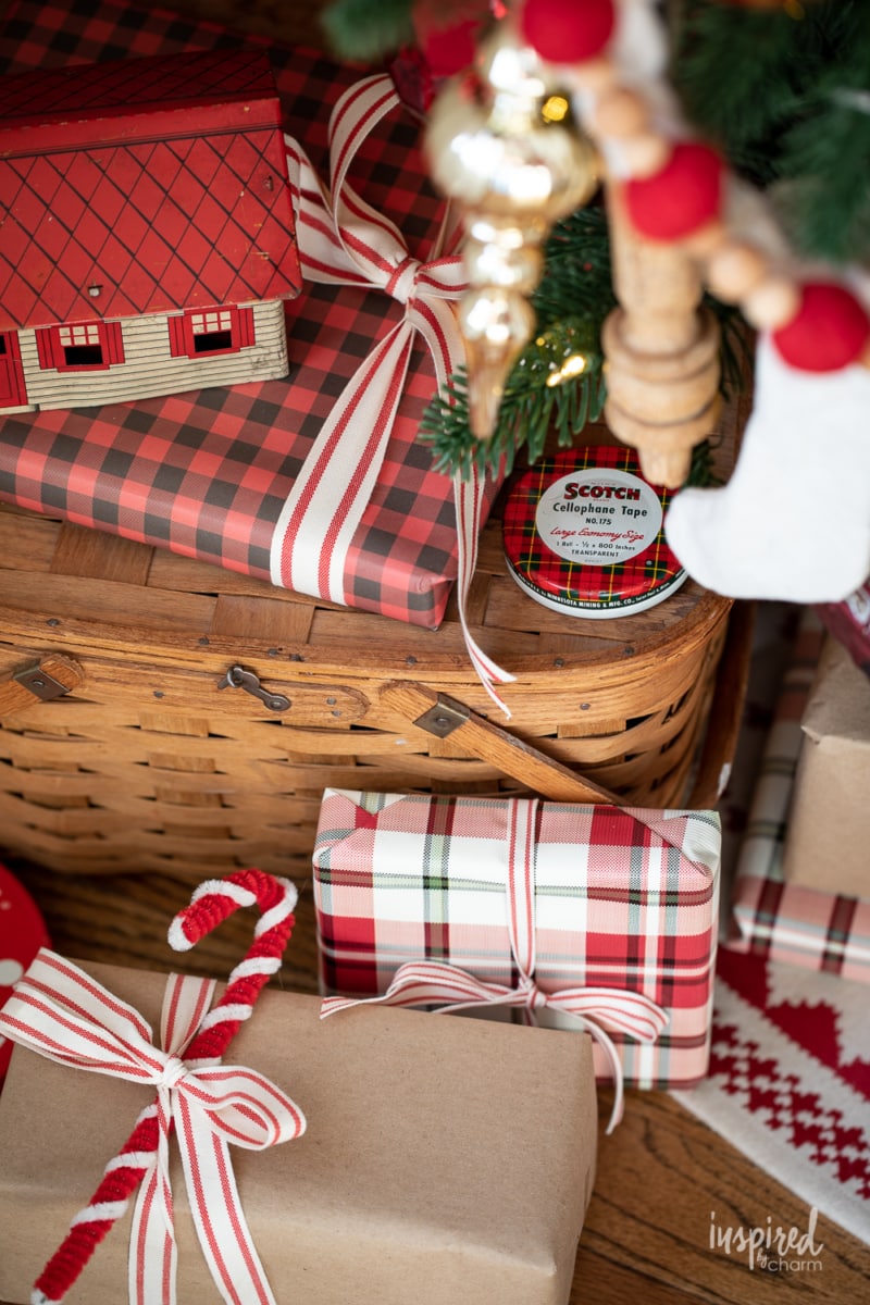 presents under a tree with a picnic basket. 