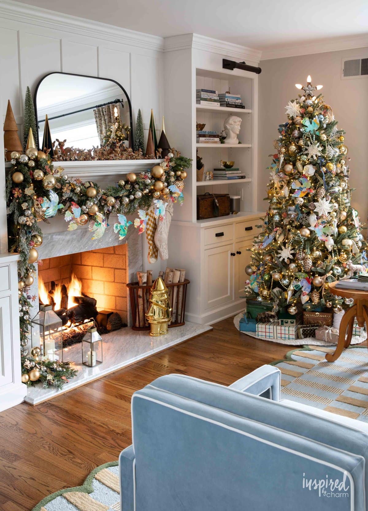 christmas mantel and christmas tree with festive decor. 