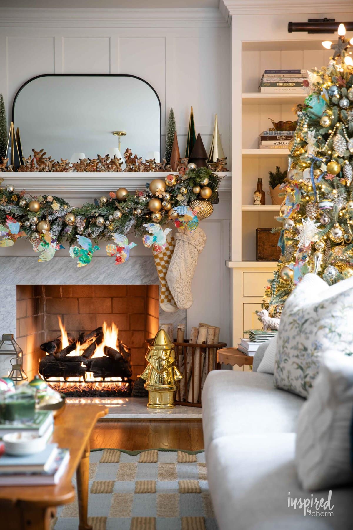 living room and mantel decorated for Christmas. 