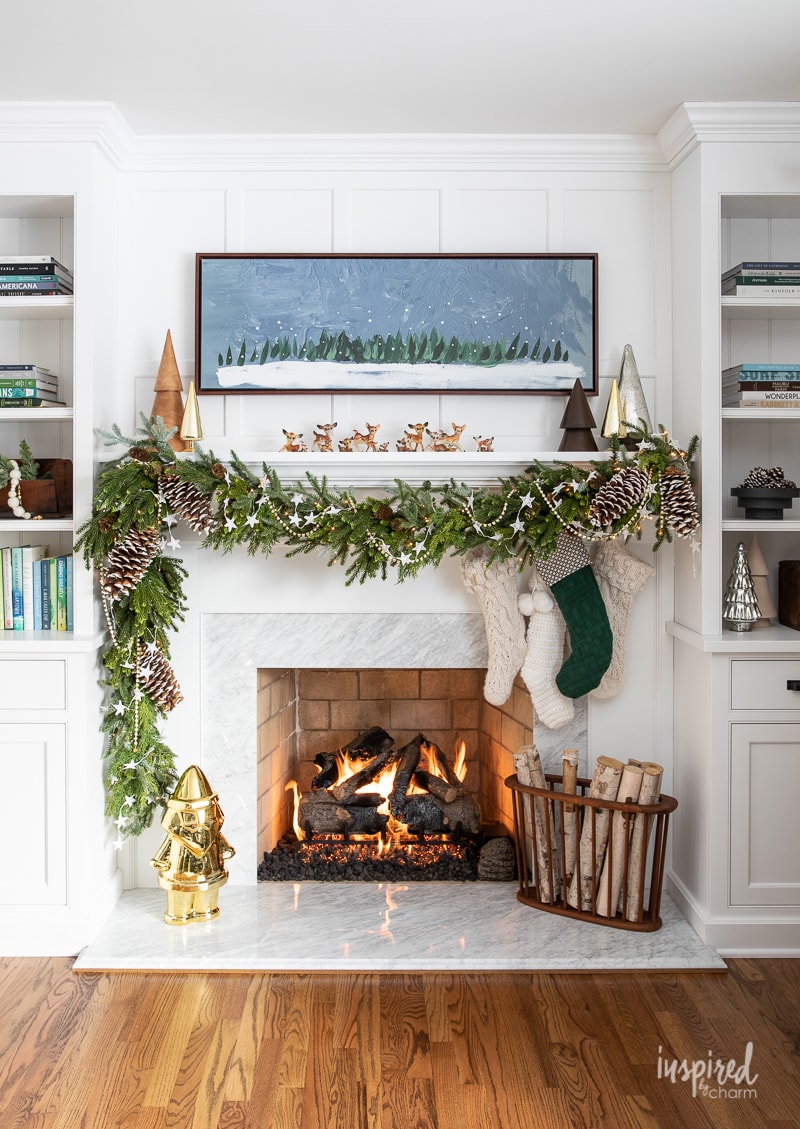 Living Room Christmas Mantel Decor #livingroom #mantel #christmas #fireplace #holiday #decor #bookshelf #bookcase #garland