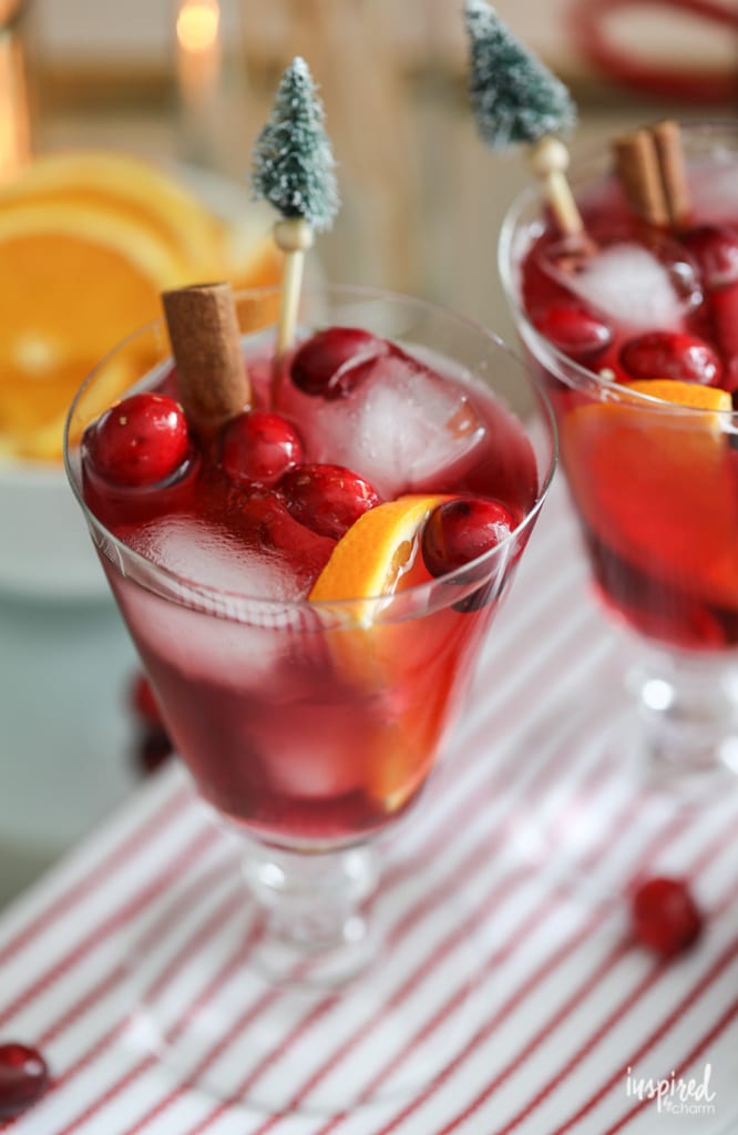 non-alcoholic holiday sangria mocktail with Christmas tree stirrer