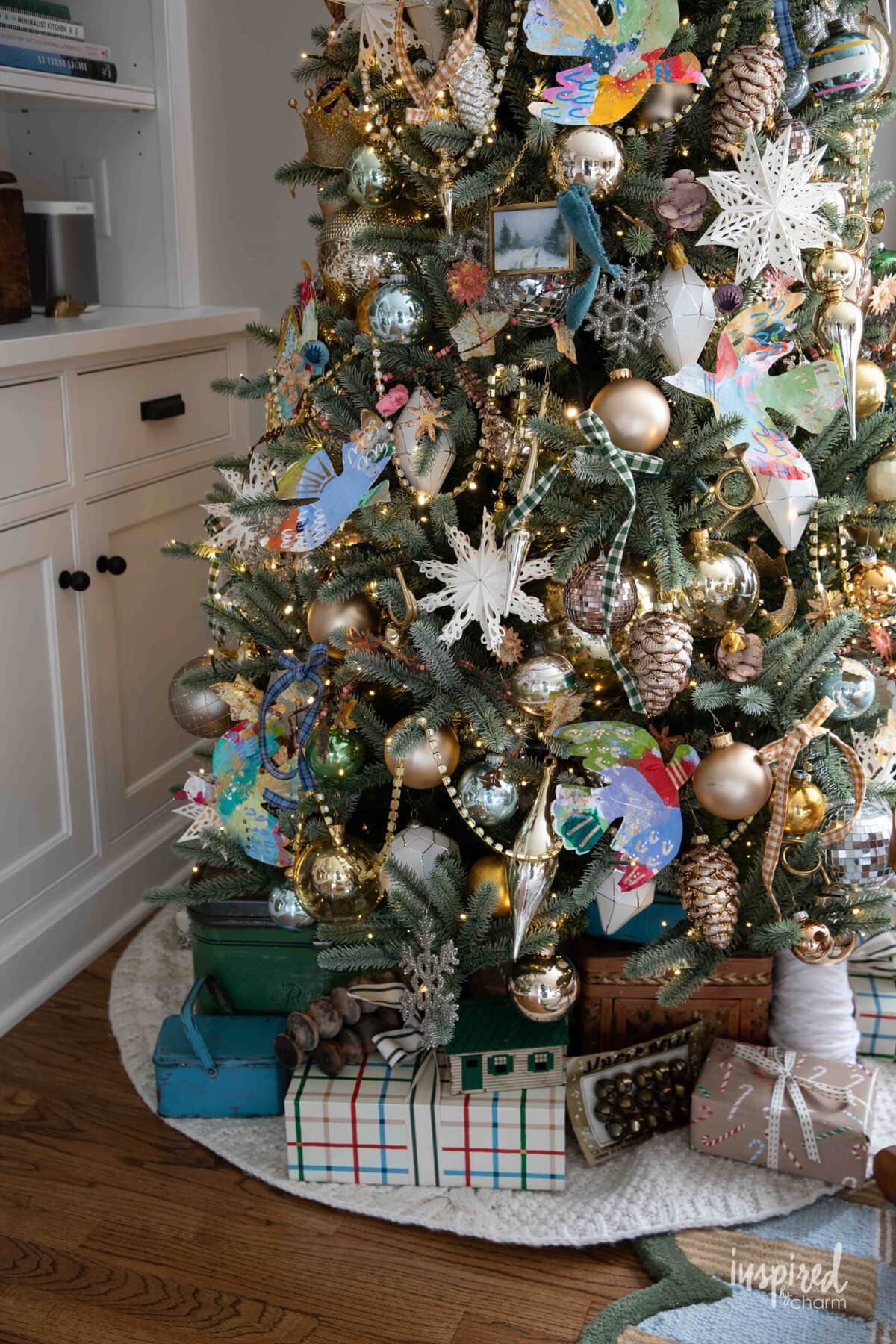Christmas tree with decor under the tree.