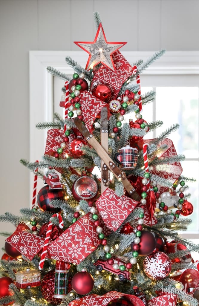 red and white tree decor with fair isle patterned ribbon