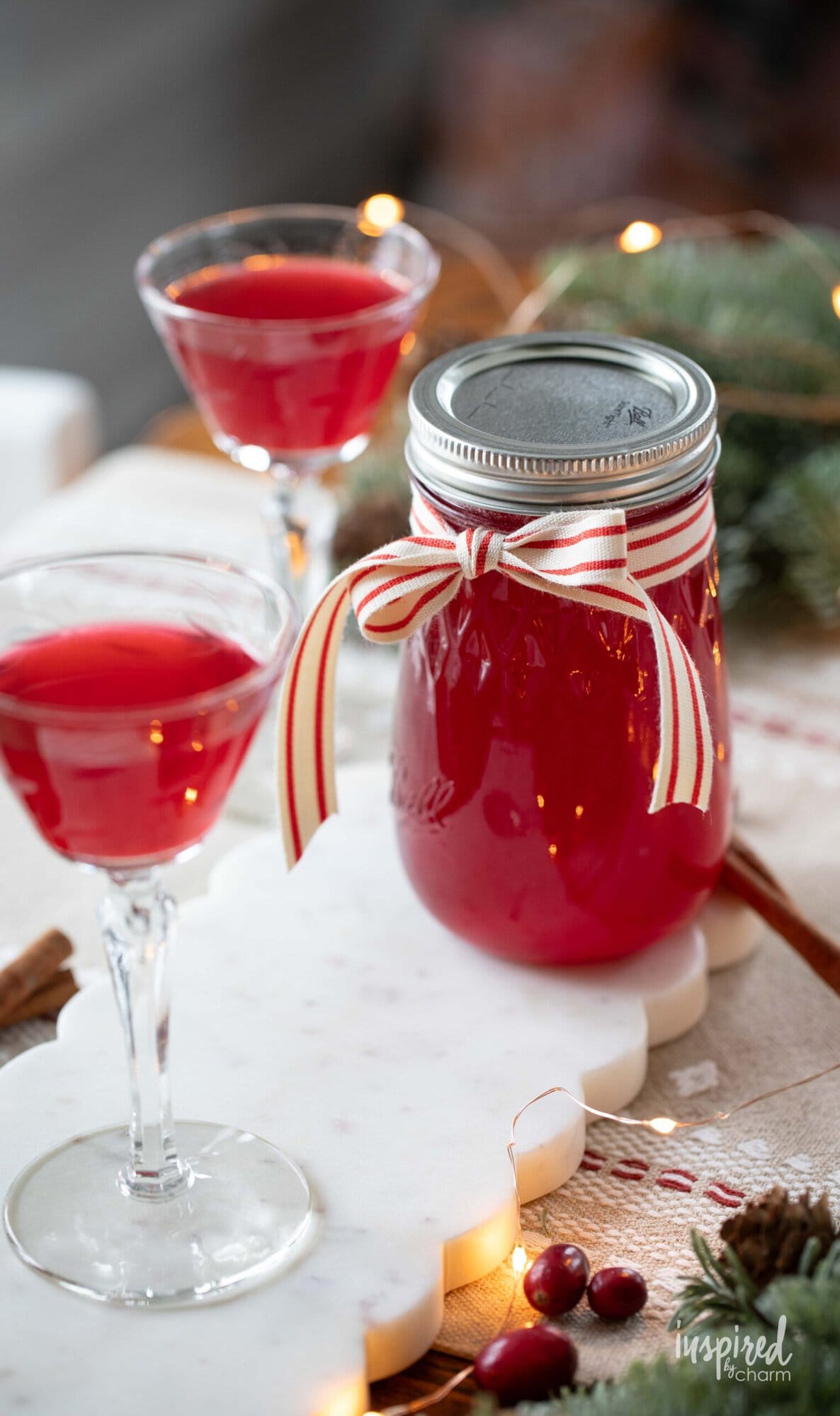 Cranberry Cordial in a moon jar and served in glasses.