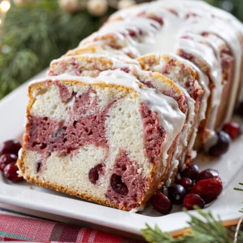Cranberry Marble Loaf Cake on a white plate.