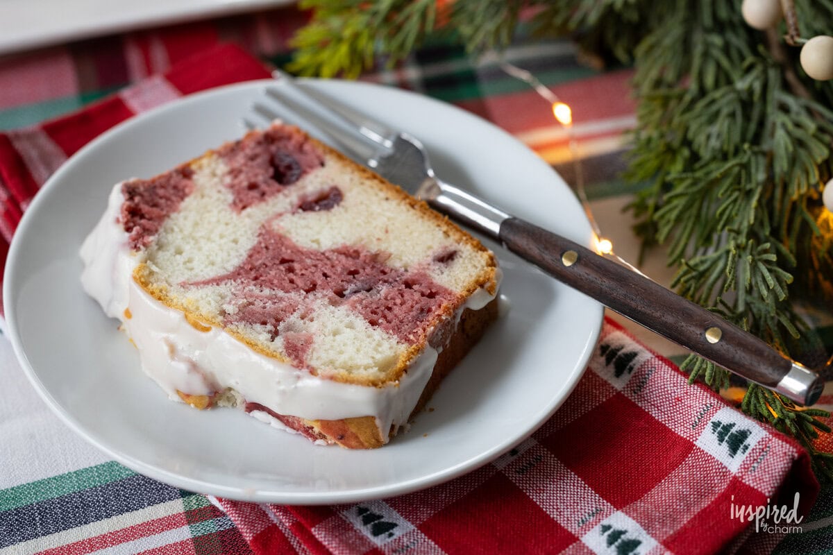 slice of Cranberry Marble Loaf Cake on a plate with a fork.