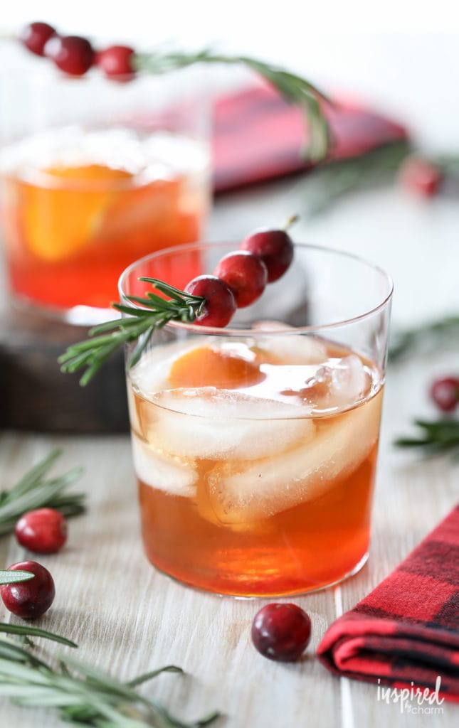 cranberry Old Fashioned drink in a short glass with festive garnish