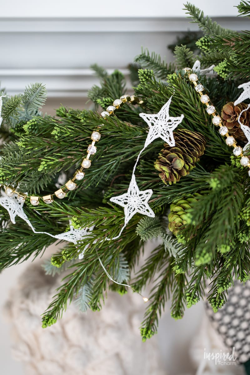 Living Room Christmas Mantel Decor #livingroom #mantel #christmas #fireplace #holiday #decor #bookshelf #bookcase #garland