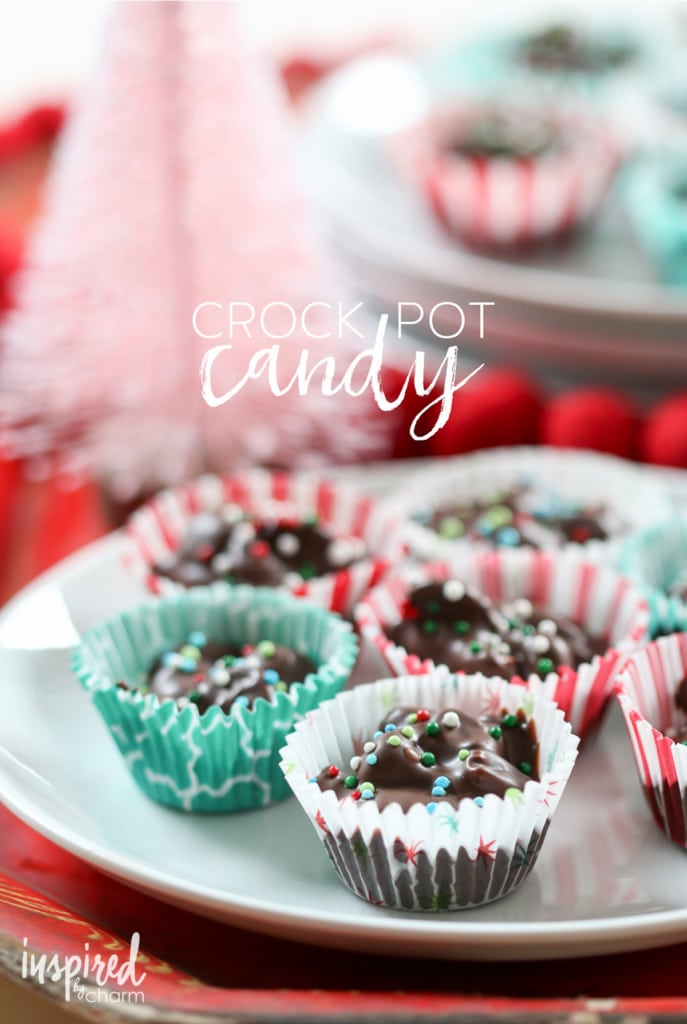 crock pot candy in paper wrappers on a white plate.