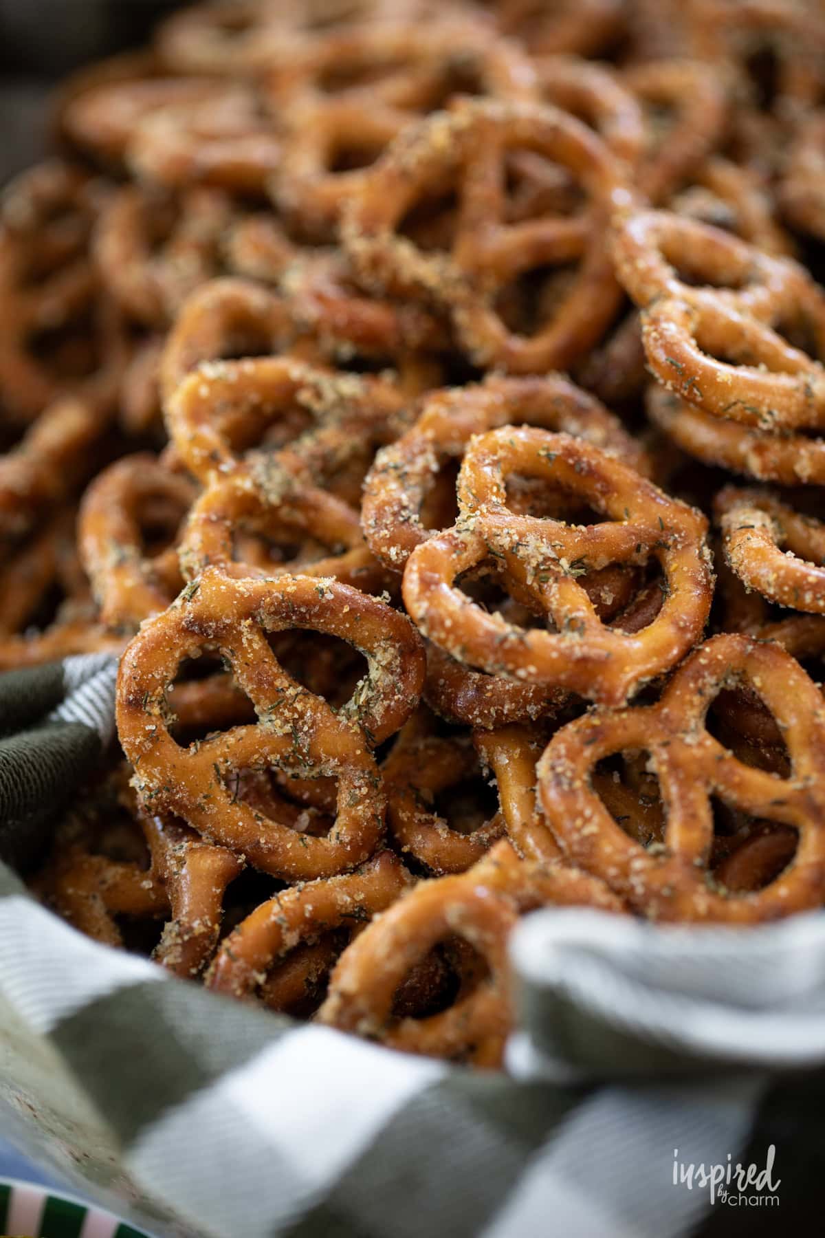 Dill Pickle Seasoned Pretzels with seasoning in a bowl.