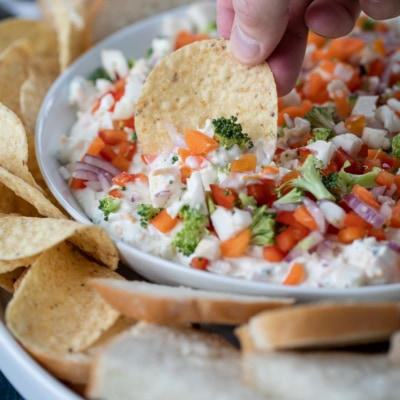 dipping into veggie pizza dip