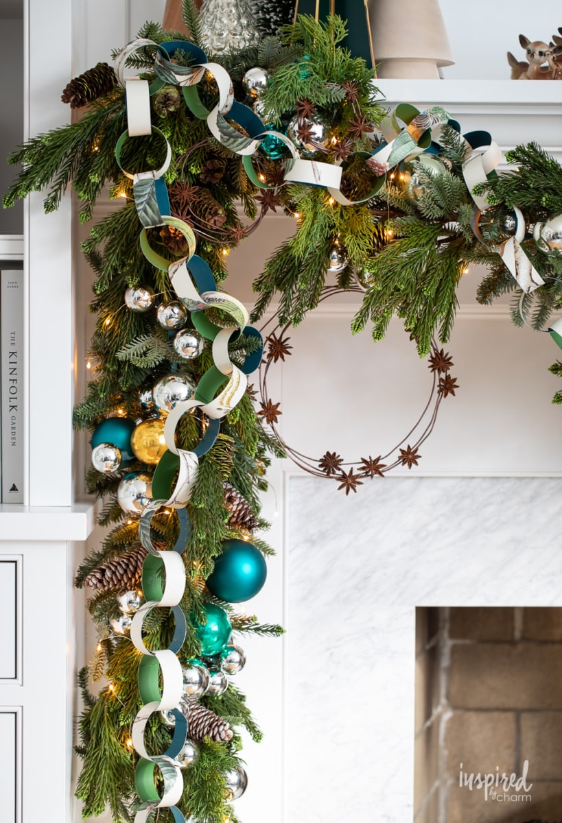 close up of mantel garland with diy paper chain and anise star wreath.