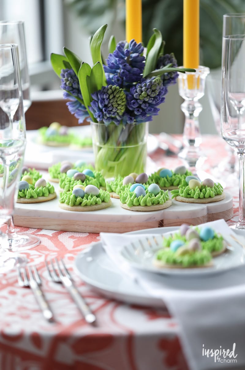 Egg Hunt Easter Cookies on a platter with flowers.