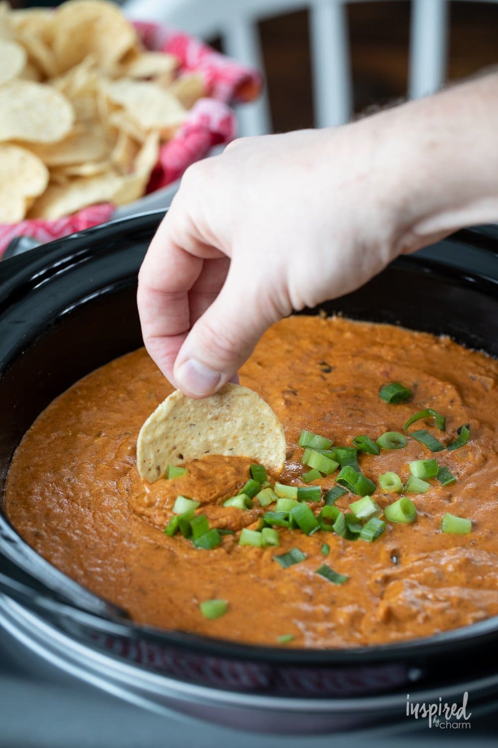 dipping in Hot Chili Cheese Dip