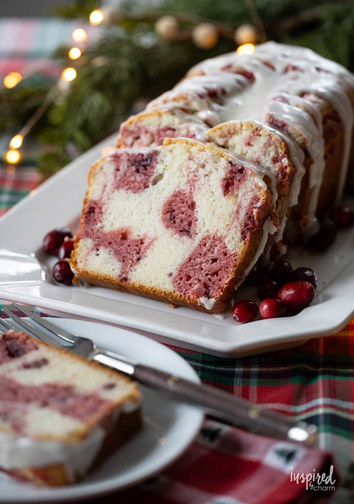 sliced Cranberry Marble Loaf Cake on a plate.
