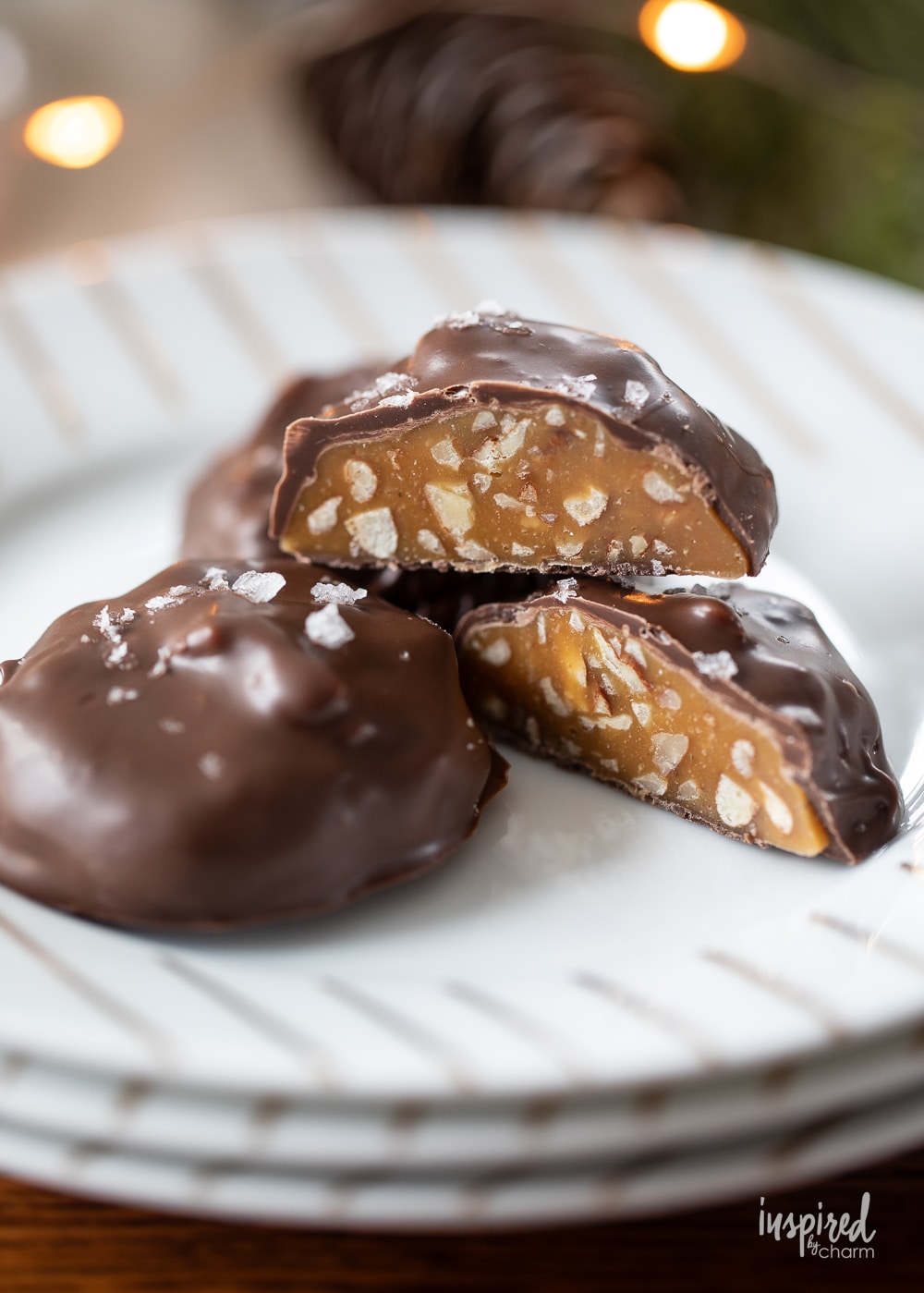 three pieces of millionaire candy on a stack of plates.