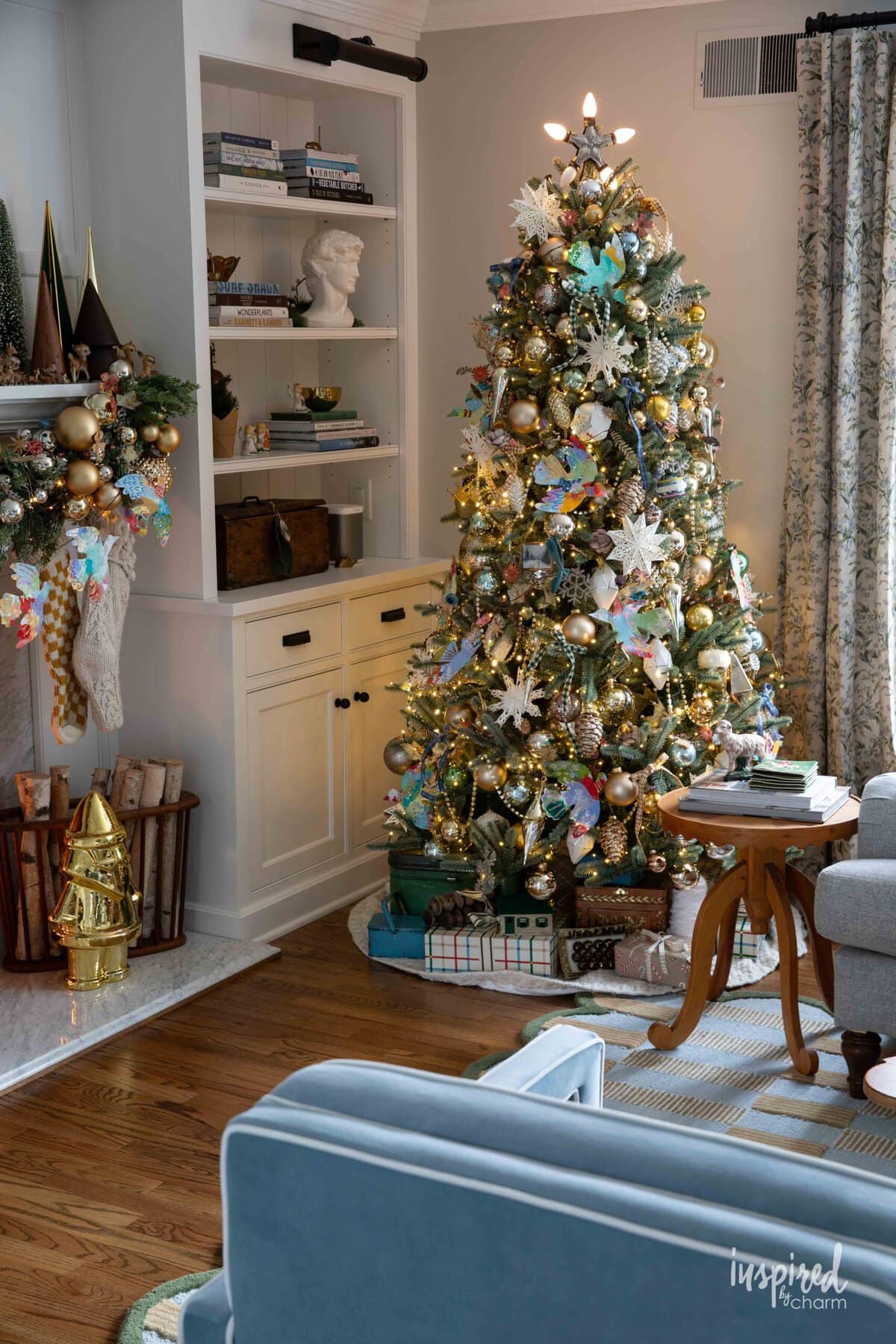 living room with cozy christmas tree with vintage and handmade decor.