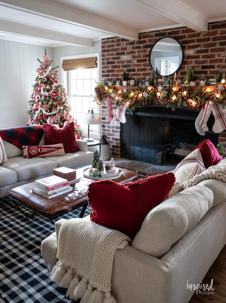 Red and Cozy Christmas decorated living room with tree.