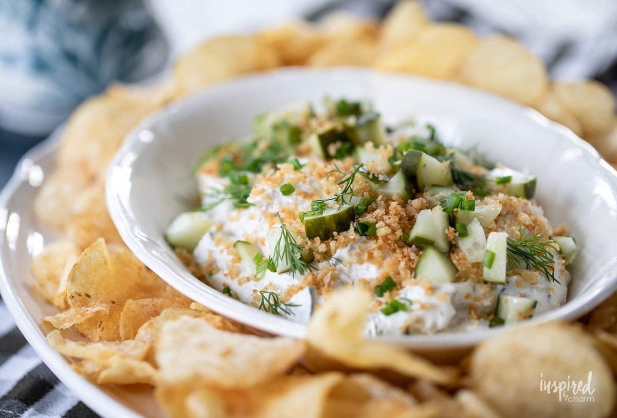 fried pickle ranch dip in a bowl with potato chips.