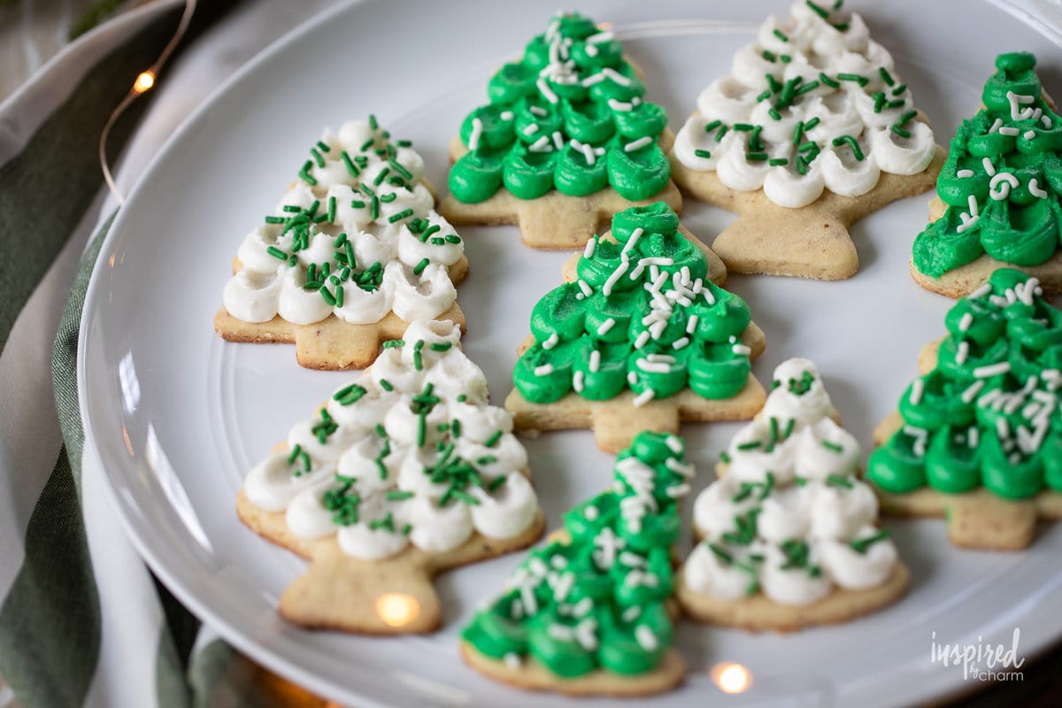 tree shaped Frosted Almond Sugar Cookies on a plate,