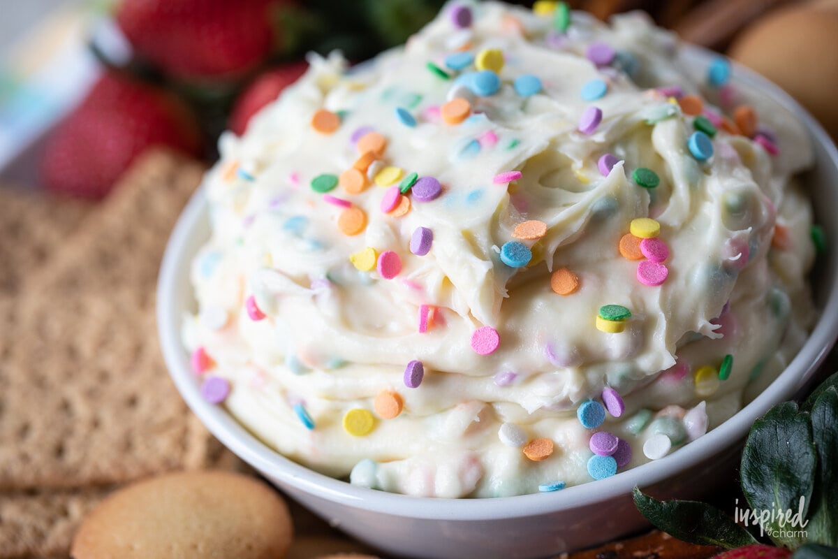 funfetti dessert dip in a bowl with sprinkles.