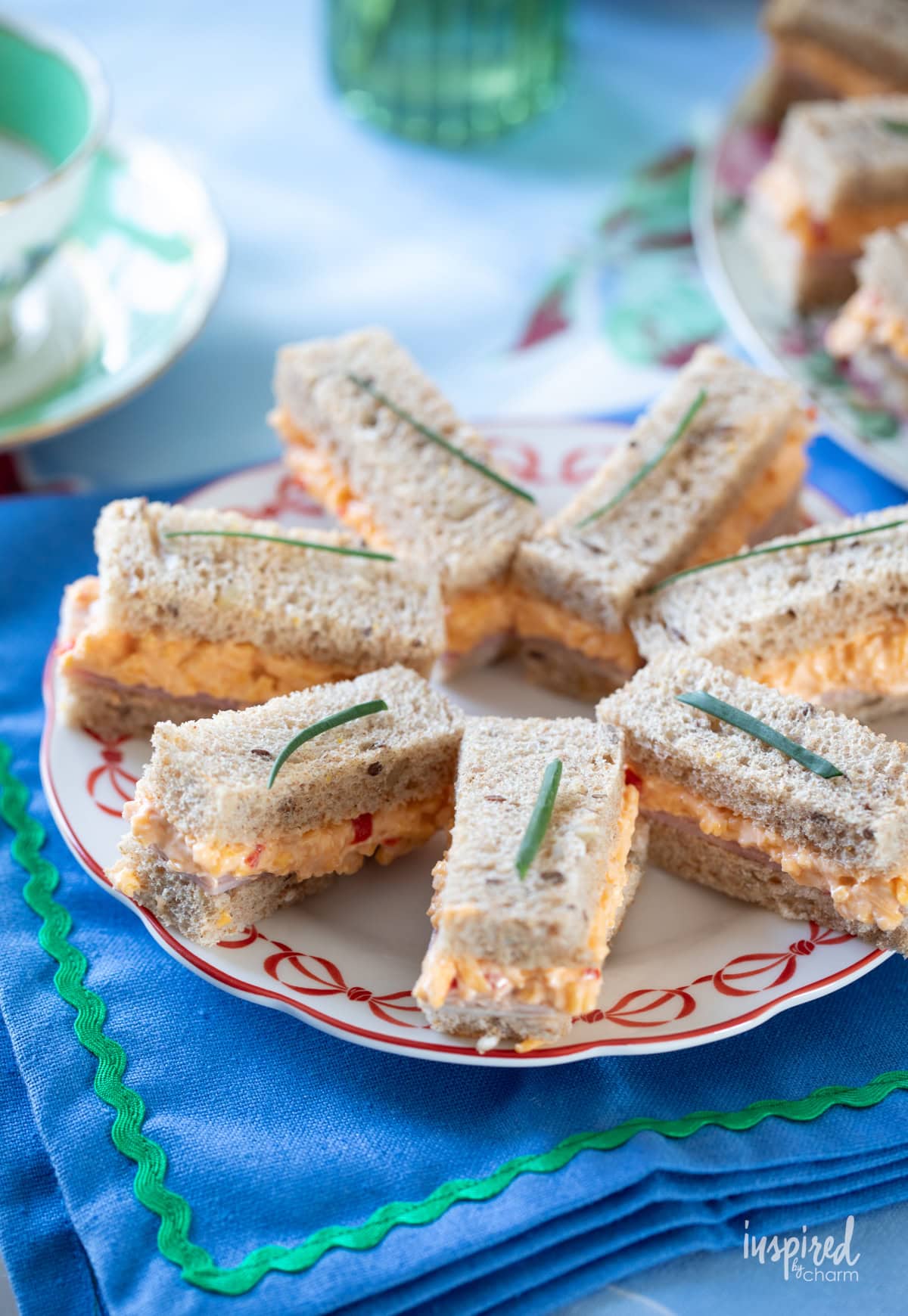 Ham and Pimento Cheese Tea Sandwiches on a plate.
