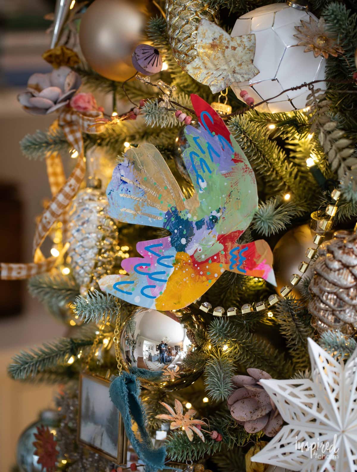 colorful painted dove on a Christmas tree.