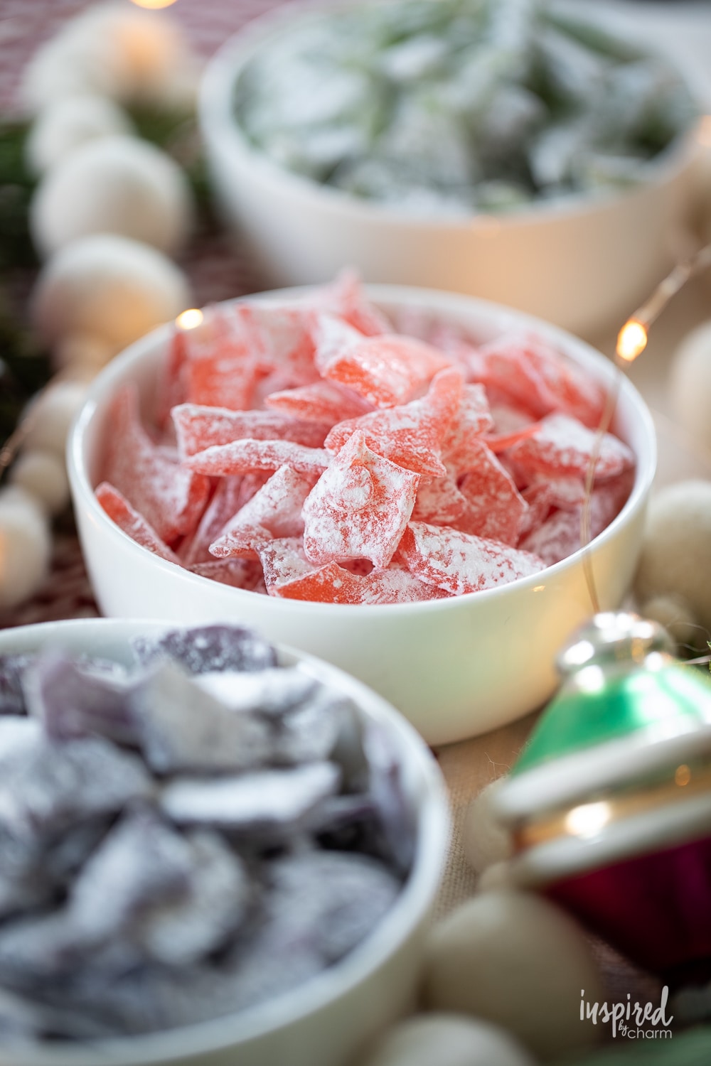 red hard tack candy in a white bowl.