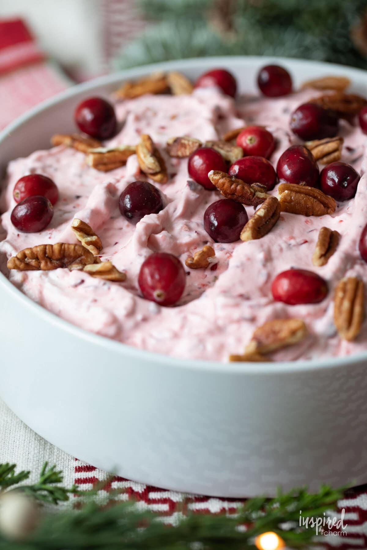 cranberry fluff salad served in a white bowl.