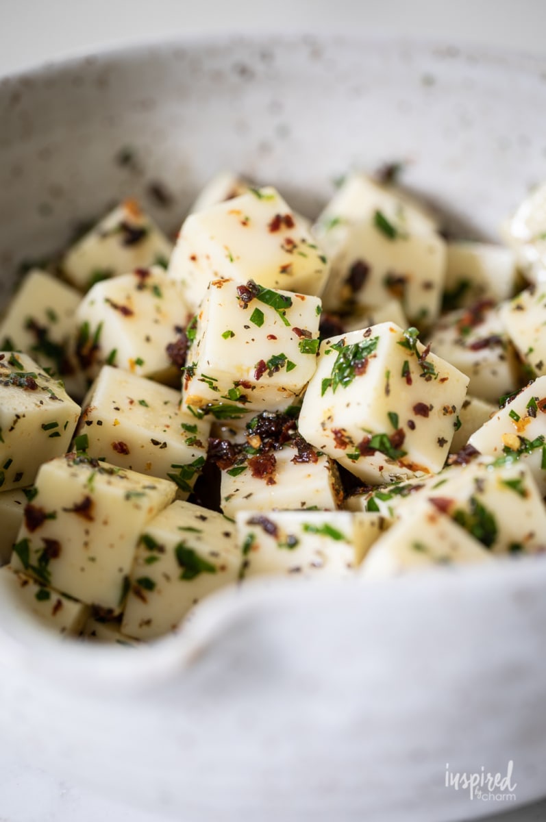 close up of Marinated Mozzarella Recipe in a bowl.
