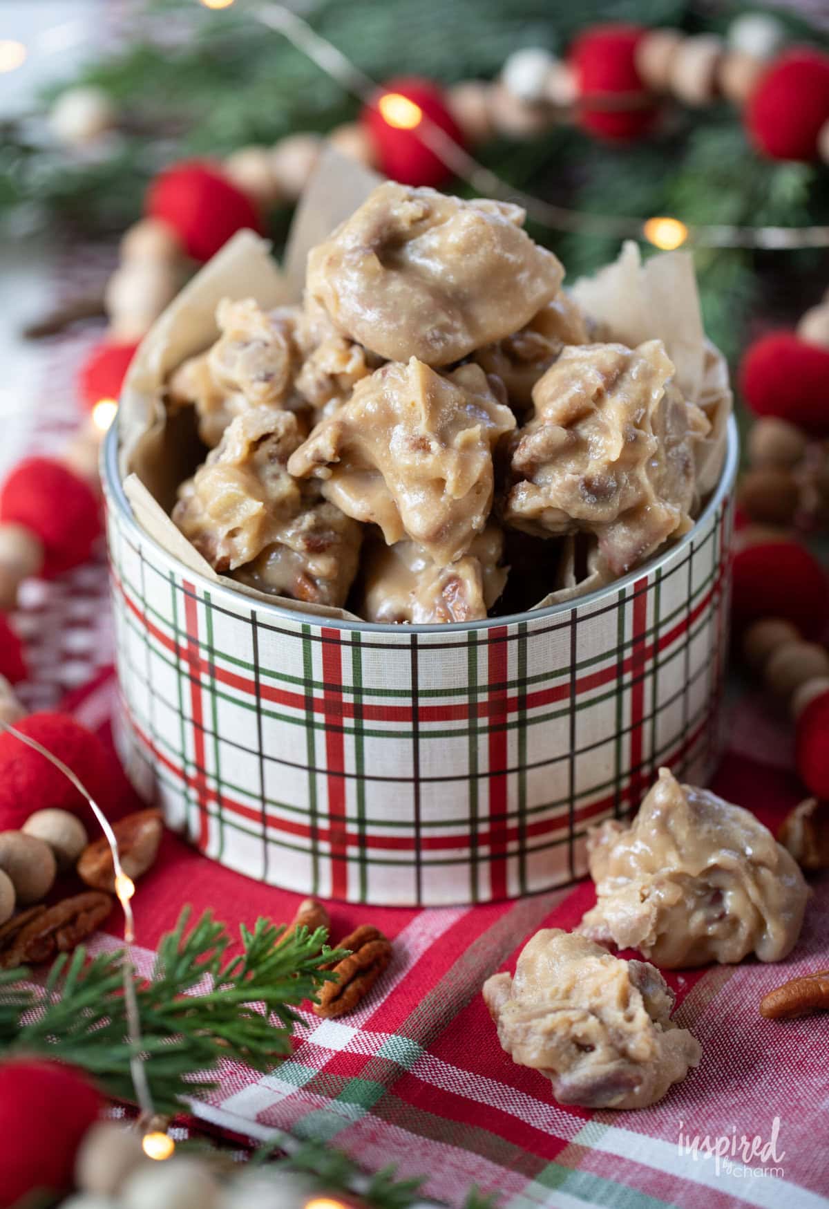 pecan pralines in plaid christmas tin.