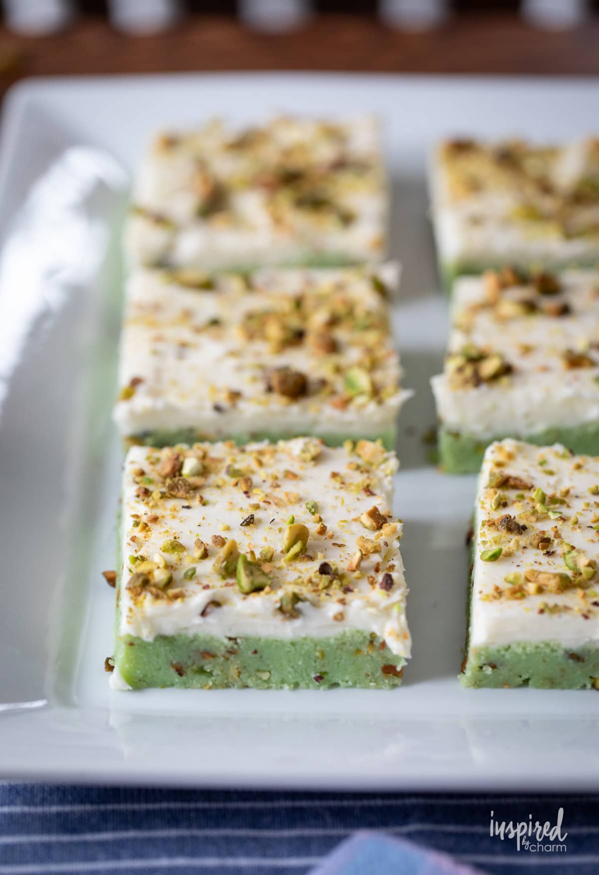 Pistachio Bars on a white platter.