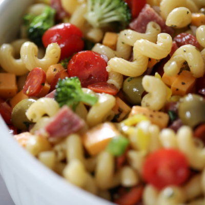 pasta salad in a big white bowl.