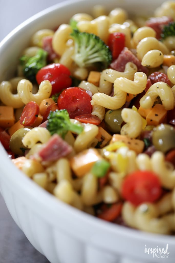 up close of pasta salad in a white bowl.