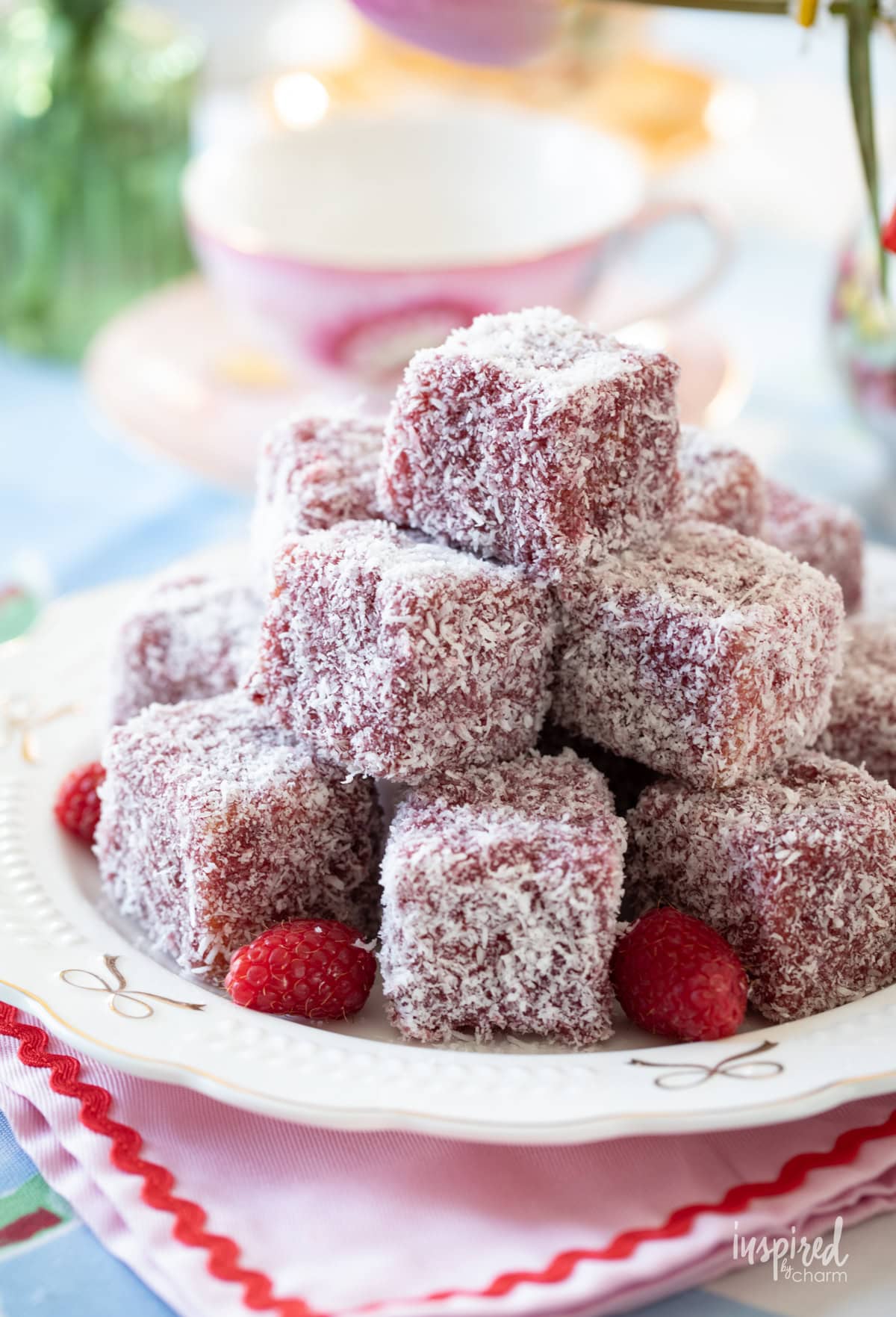 Jam and Coconut Cakes stacked on a plate.