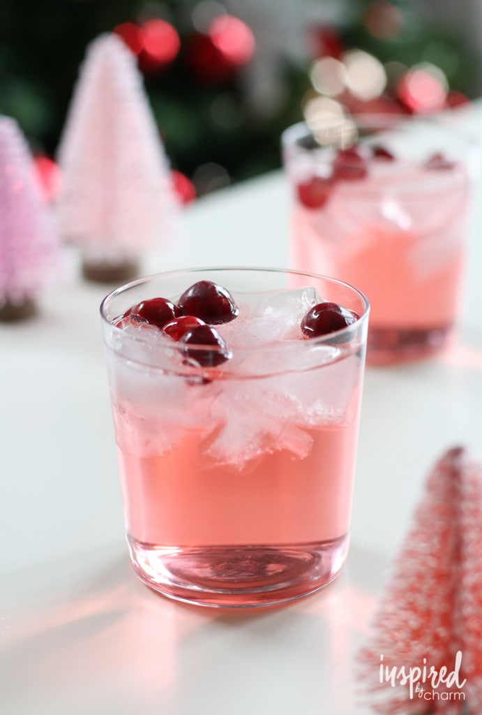 pink hued Jingle Punch in a glass - one of the most popular Christmas cocktail recipes