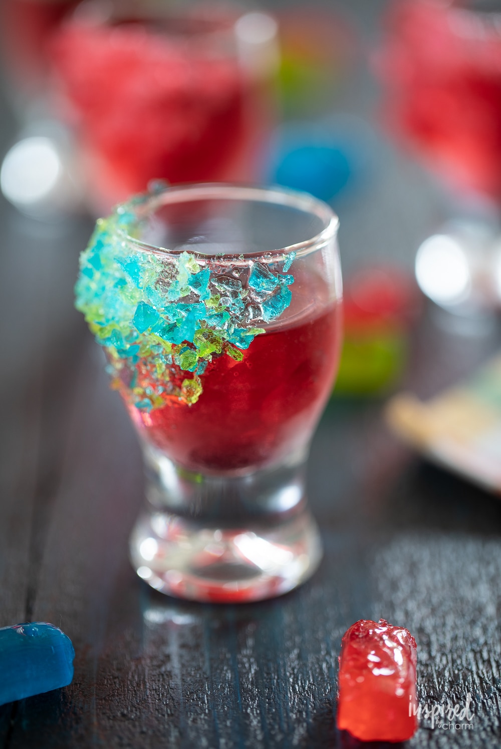jolly rancher shot in a shot glass with crushed jolly rancher garnish.