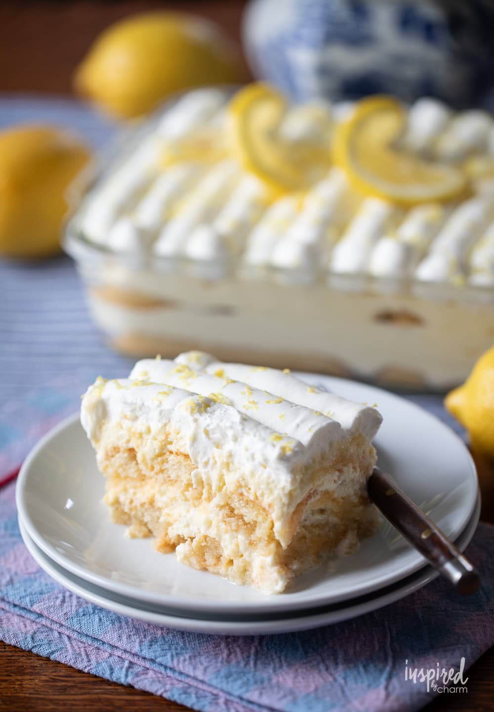 lemon tiramisu in a pan and served on a plate with a fork.